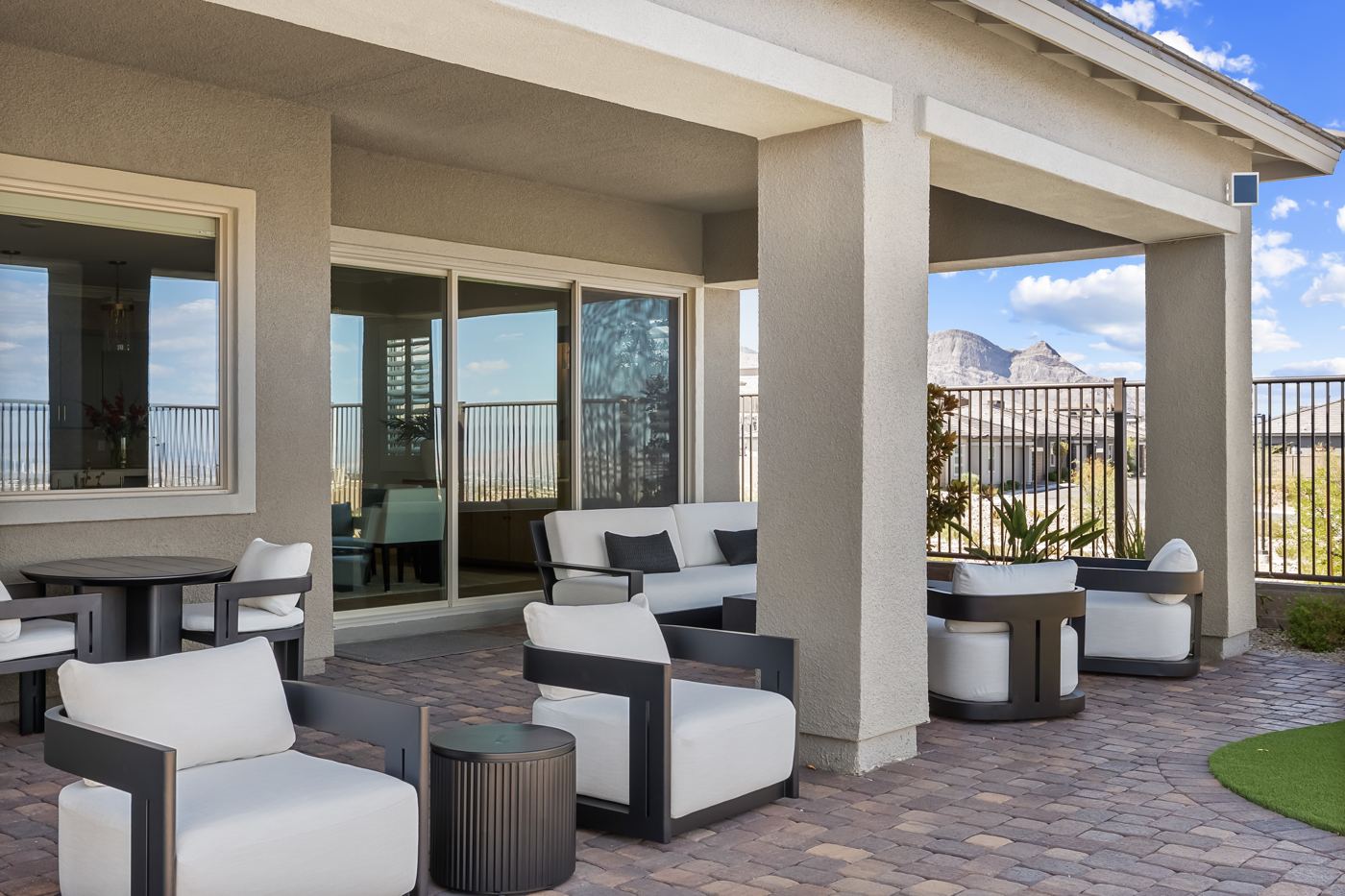 Covered patio seating with a mountain view